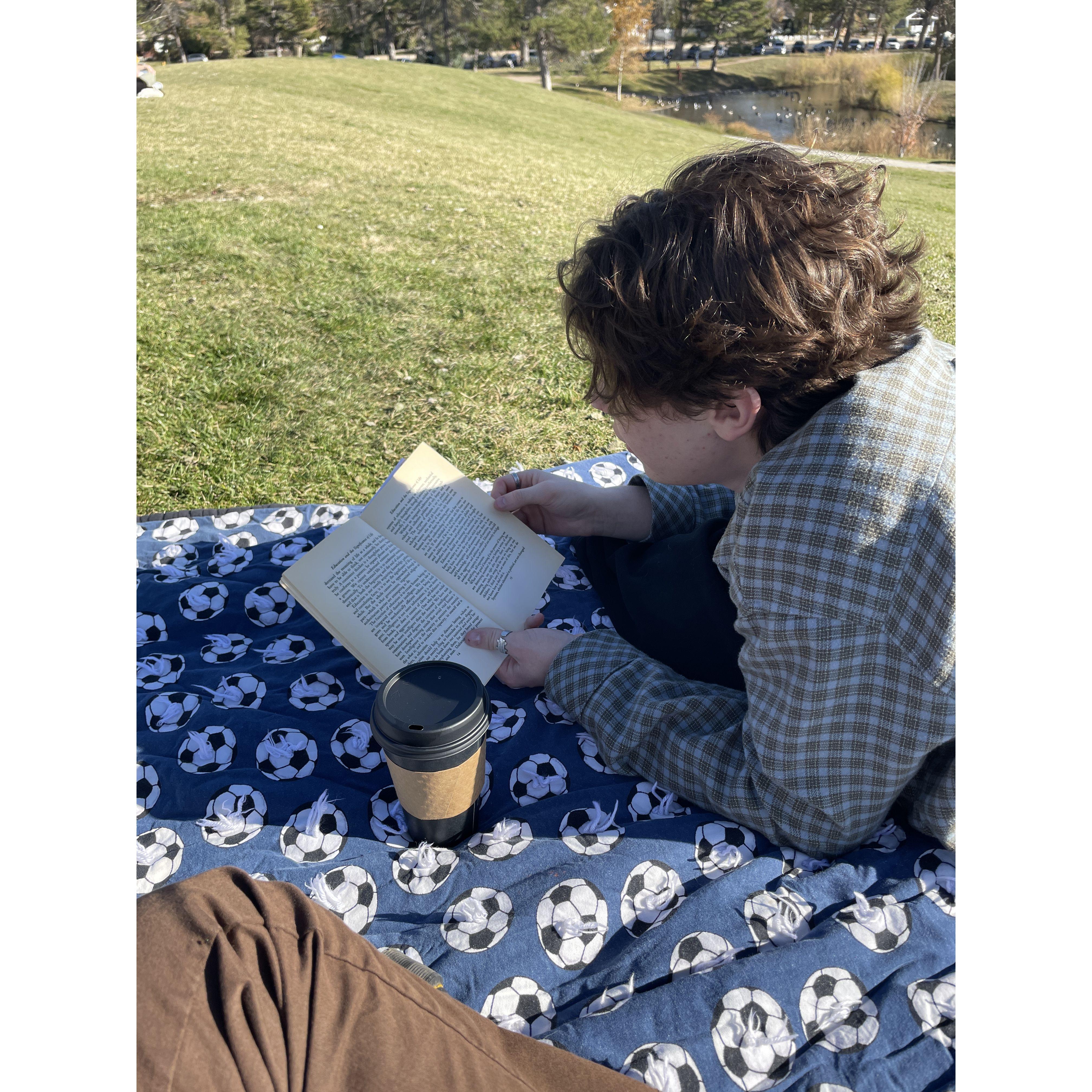 Reading a great book at the park.