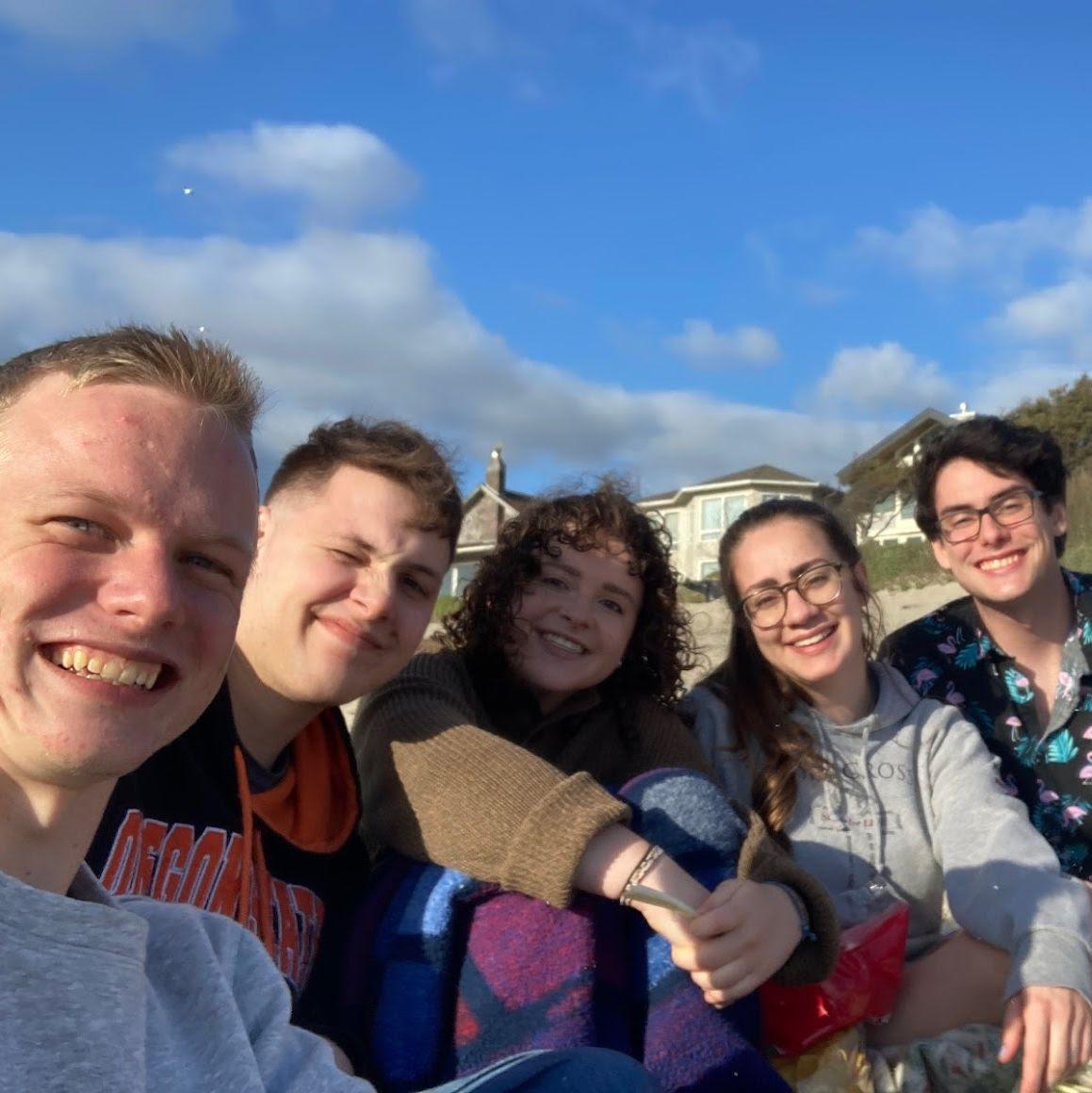 6/2022: Thankfully, motivated classmates tried to get the alumni together a few times a year if possible, with summer beach trips and the like. Here, look who’s sitting next to each other again…