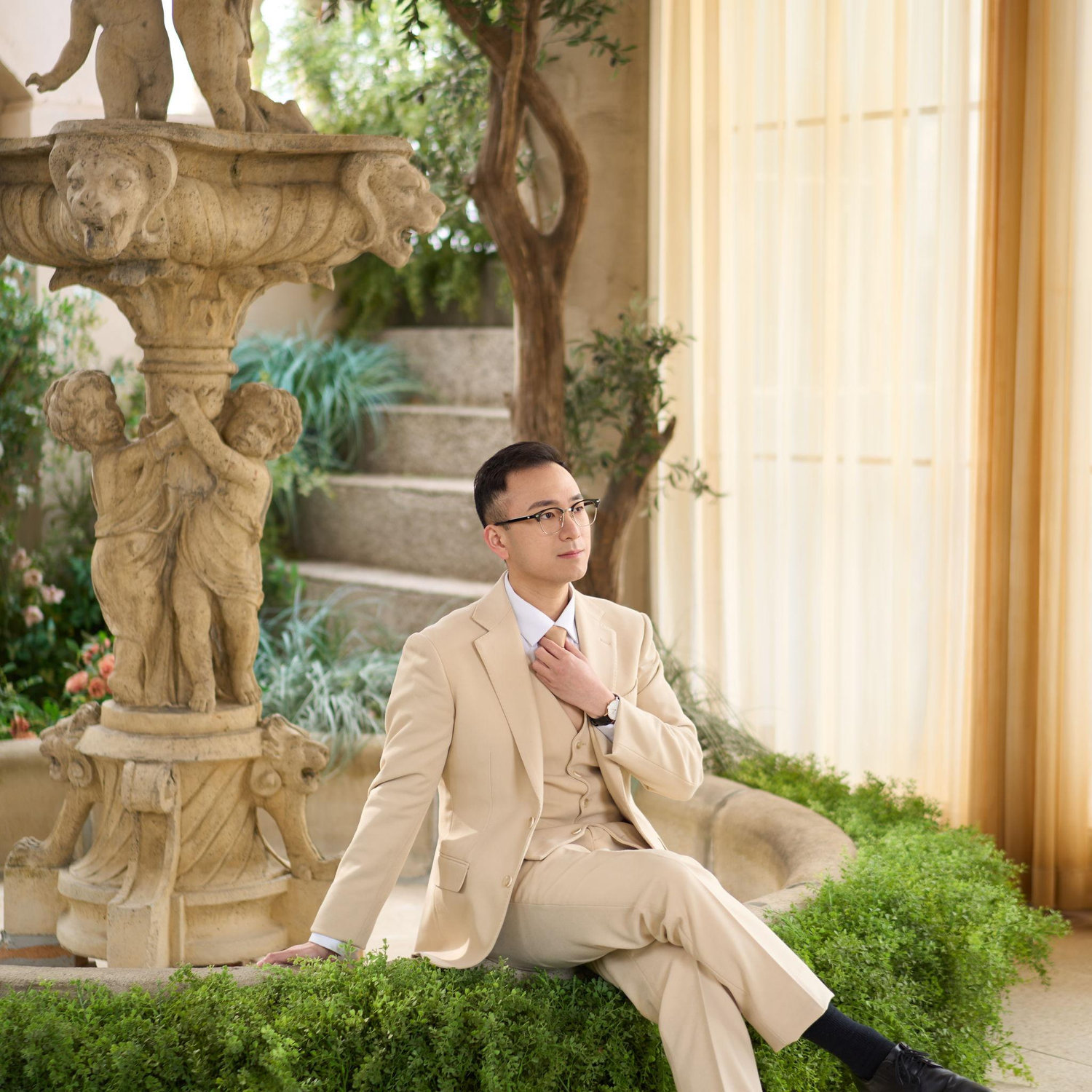 Waiting for his bride. Too busy smiling.
