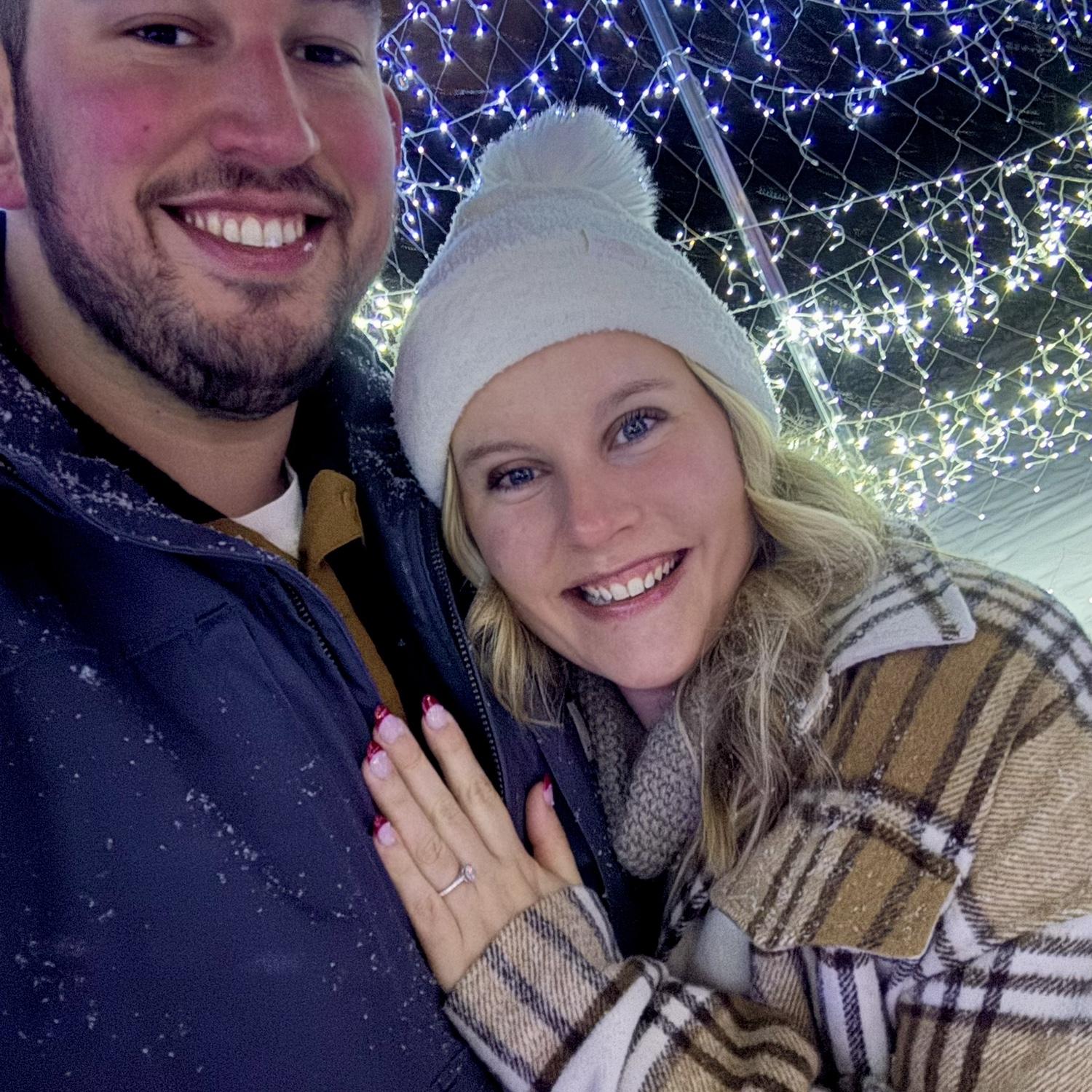 On our 2.5 year anniversary, we went to walk-thru christmas lights. Infront of the most twinkly lights, Joe proposed. As I said yes, snow started falling. We ended with a horse drawn carriage ride♥️