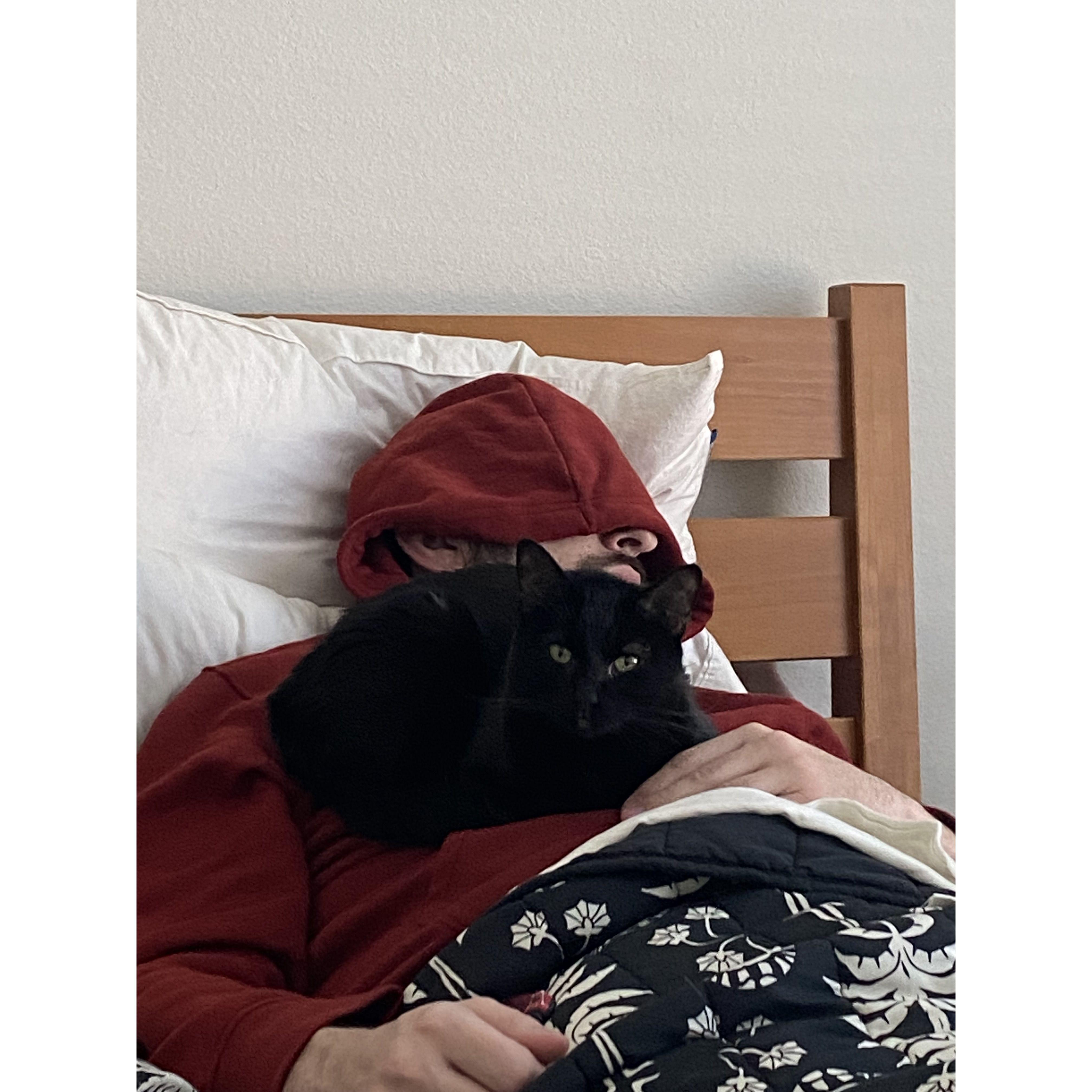 Wednesday (Valery's cat, passed away March 2023) napping with her favorite guy