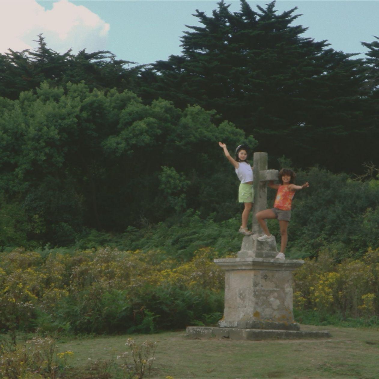 Debbie and Margot climbing the local monuments after church.