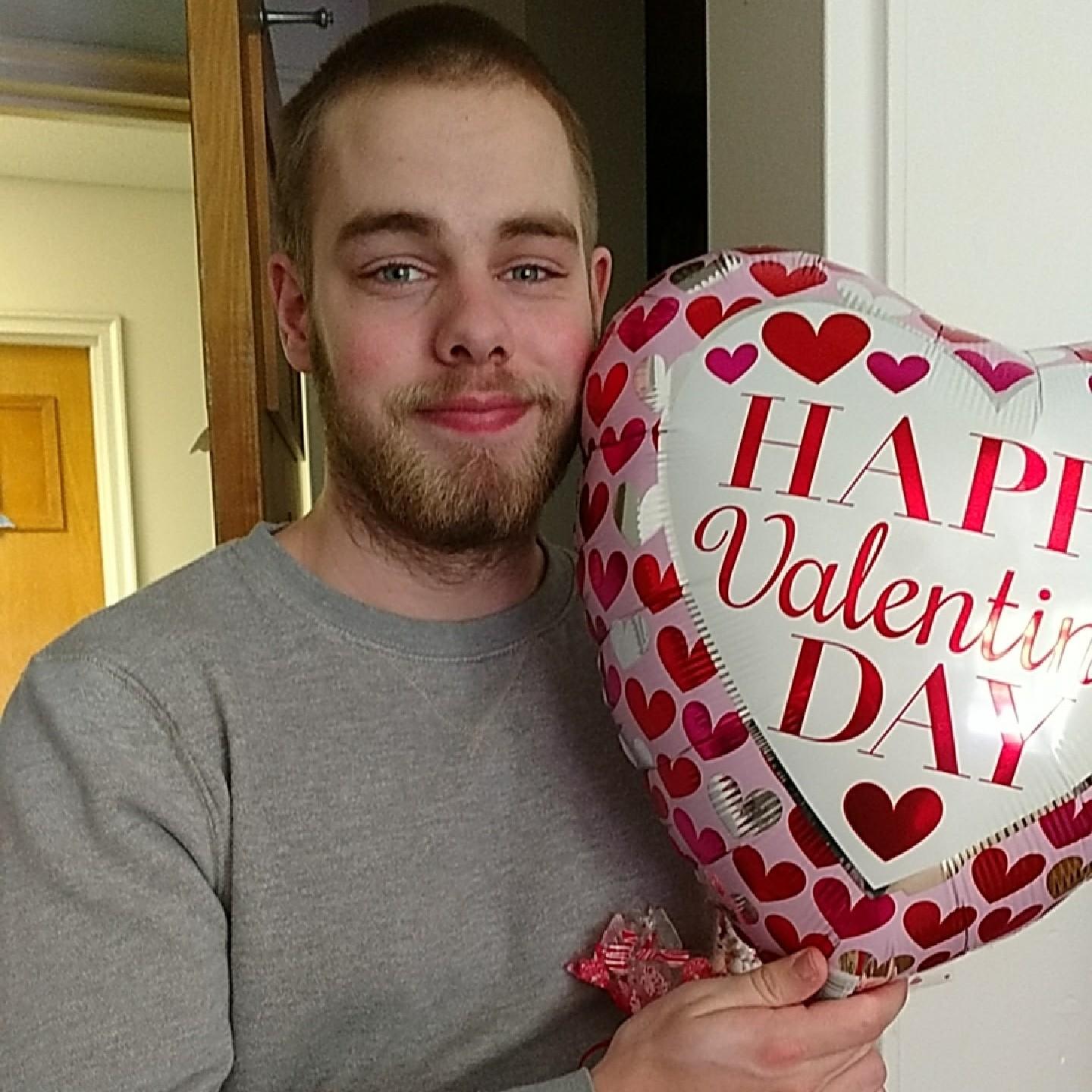 Aaron smiling for a picture after Kim had given him his Valentine's day present.
