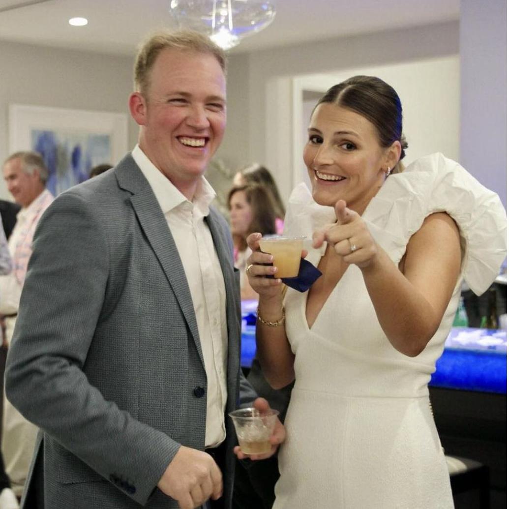 Gretchen and Ethan having a laugh at their engagement party.