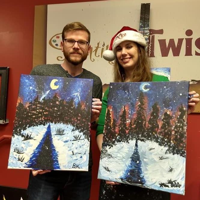 Showing off our artistic skills at Painting with a Twist in Rochester, Michigan