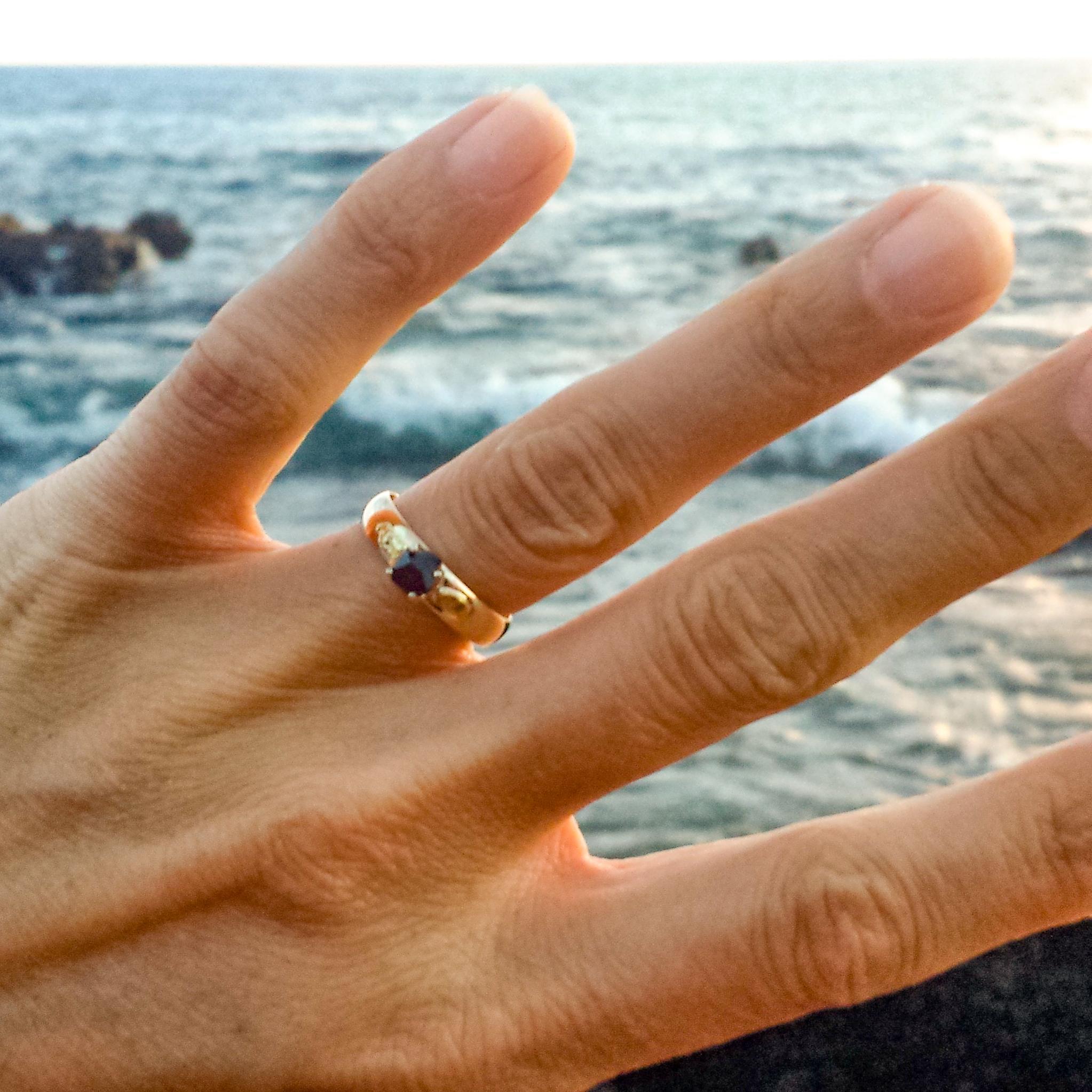 I said "yes"
After over 4 years of travel, we moved back to Hawaii and Adam proposed. He made the ring from gold we panned in Alaska and a garnet stone we found while camping in Nevada. I said "yes!"