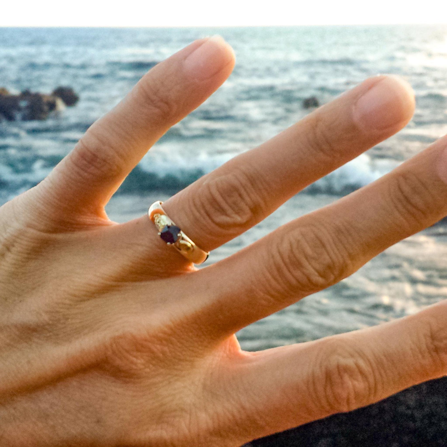 I said "yes"
After over 4 years of travel, we moved back to Hawaii and Adam proposed. He made the ring from gold we panned in Alaska and a garnet stone we found while camping in Nevada. I said "yes!"
