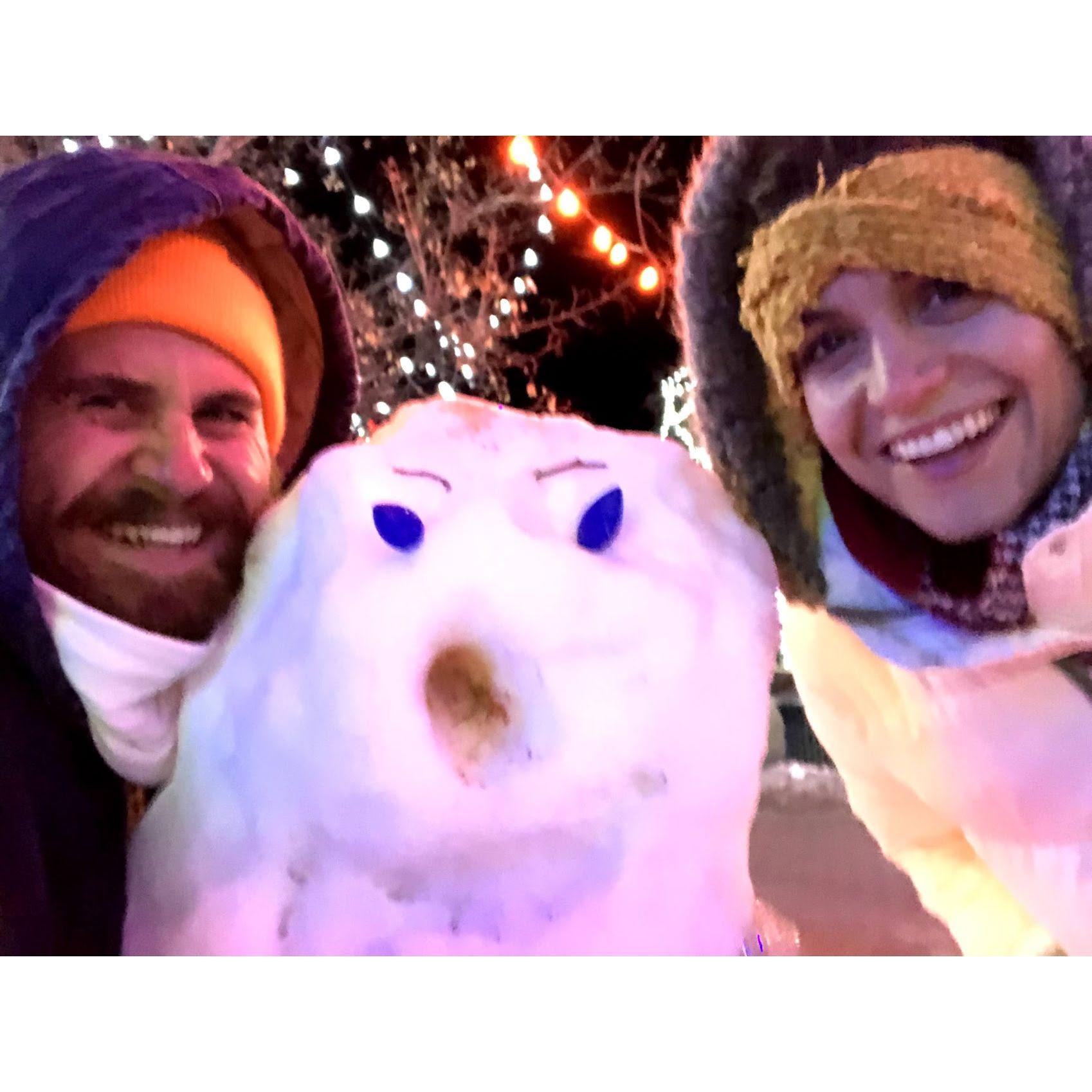 Sam builds her first snow person. Clearly she grew up on the beach. Santa Fe, NM. December 2019.