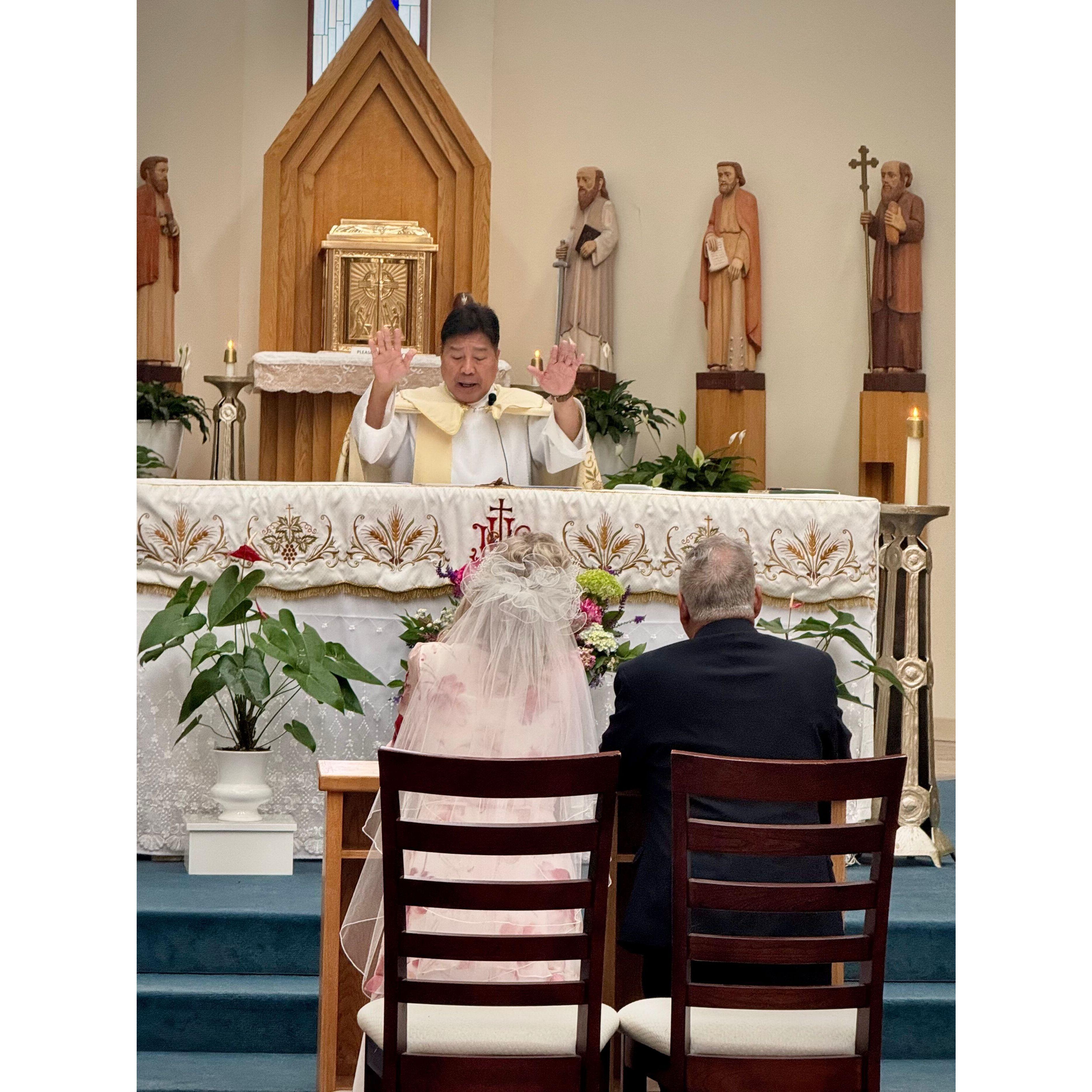 Father Abundo gives a blessing.