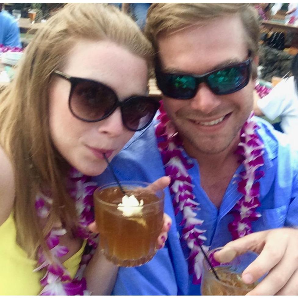 Enjoying Mai Tais at a luau in Hawaii on a family trip with the Gwaltneys!