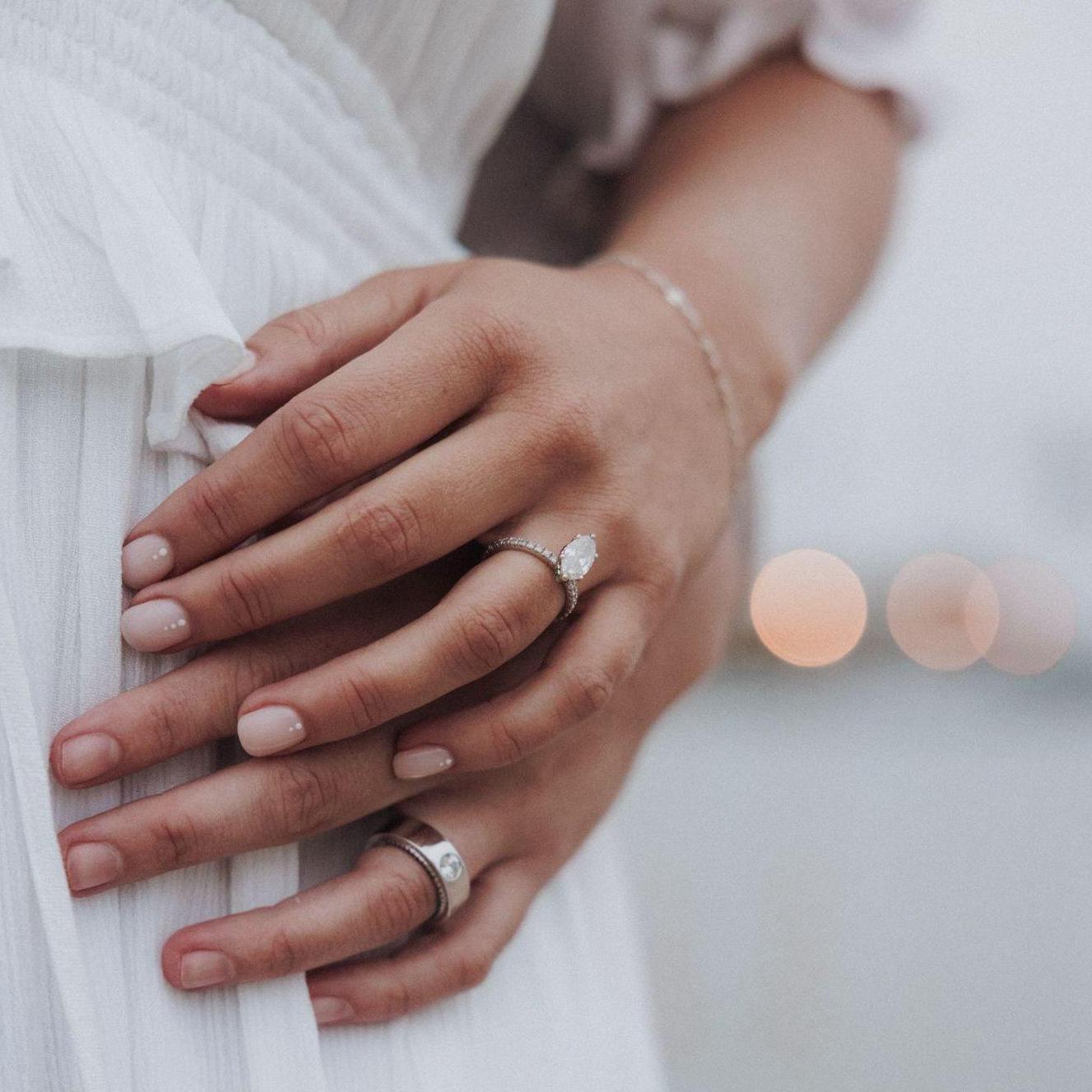 Casey & Emma's engagement rings. Both with special rainbow hidden haloes.