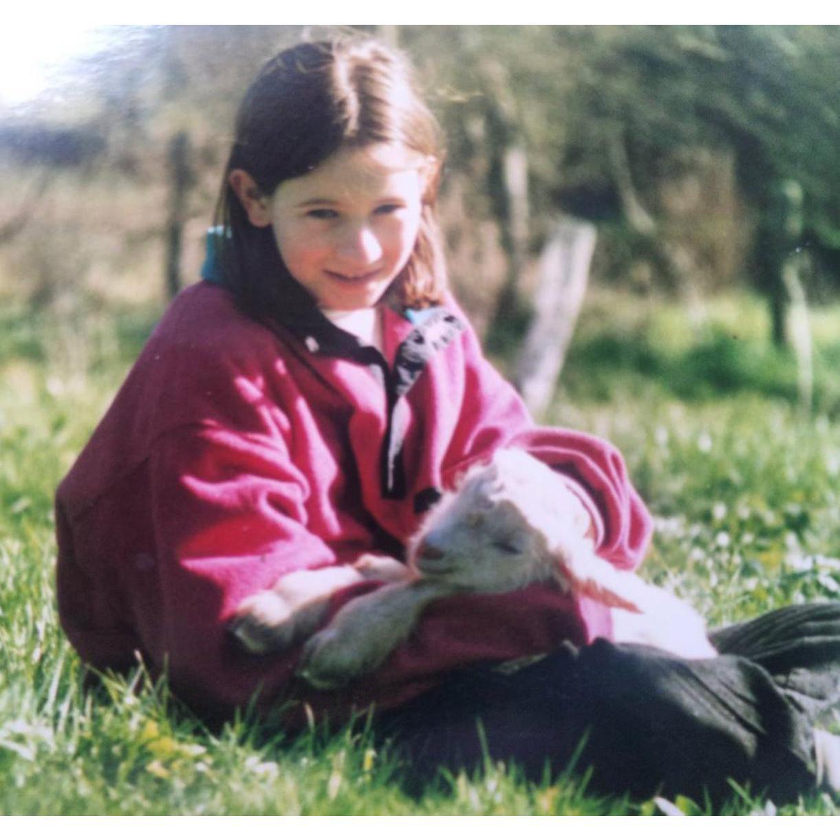 Baby Sarita with one of her pet goats, "Snowy"