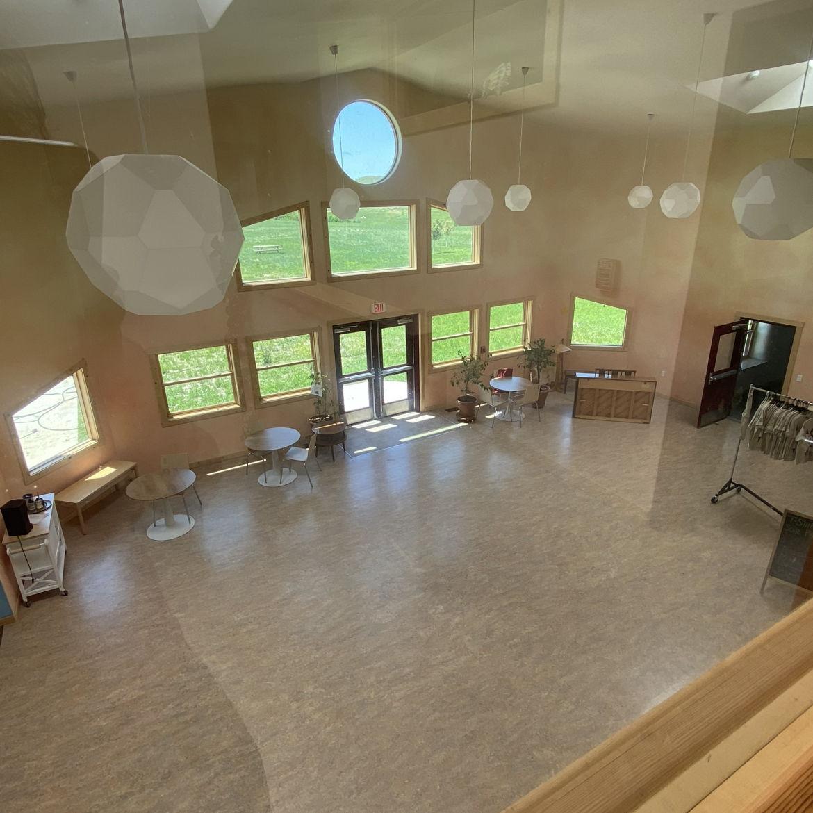 Dinner will be set up in the main sunroom. To the left of this space, there is an additional room where the buffet will be arranged.