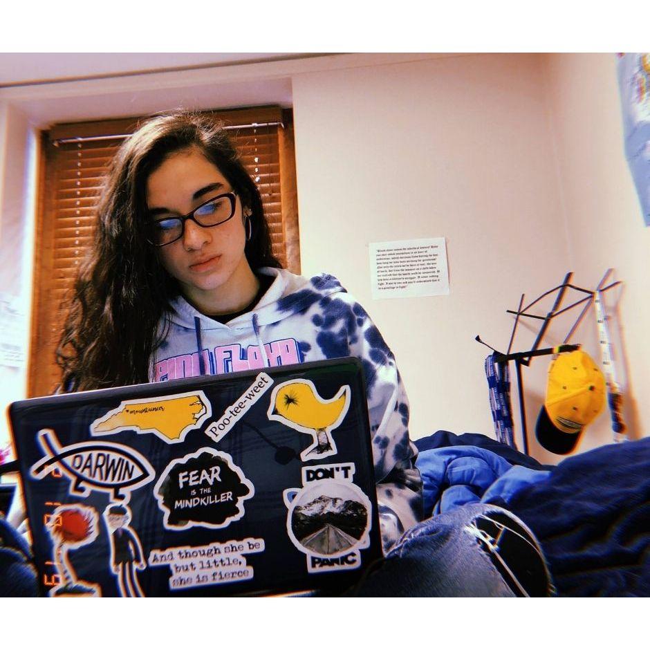 Norma studying in John's dorm.