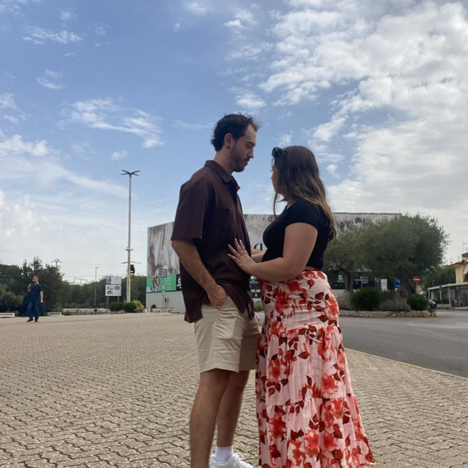 The bride and groom taking photos in the city while exploring Italy!