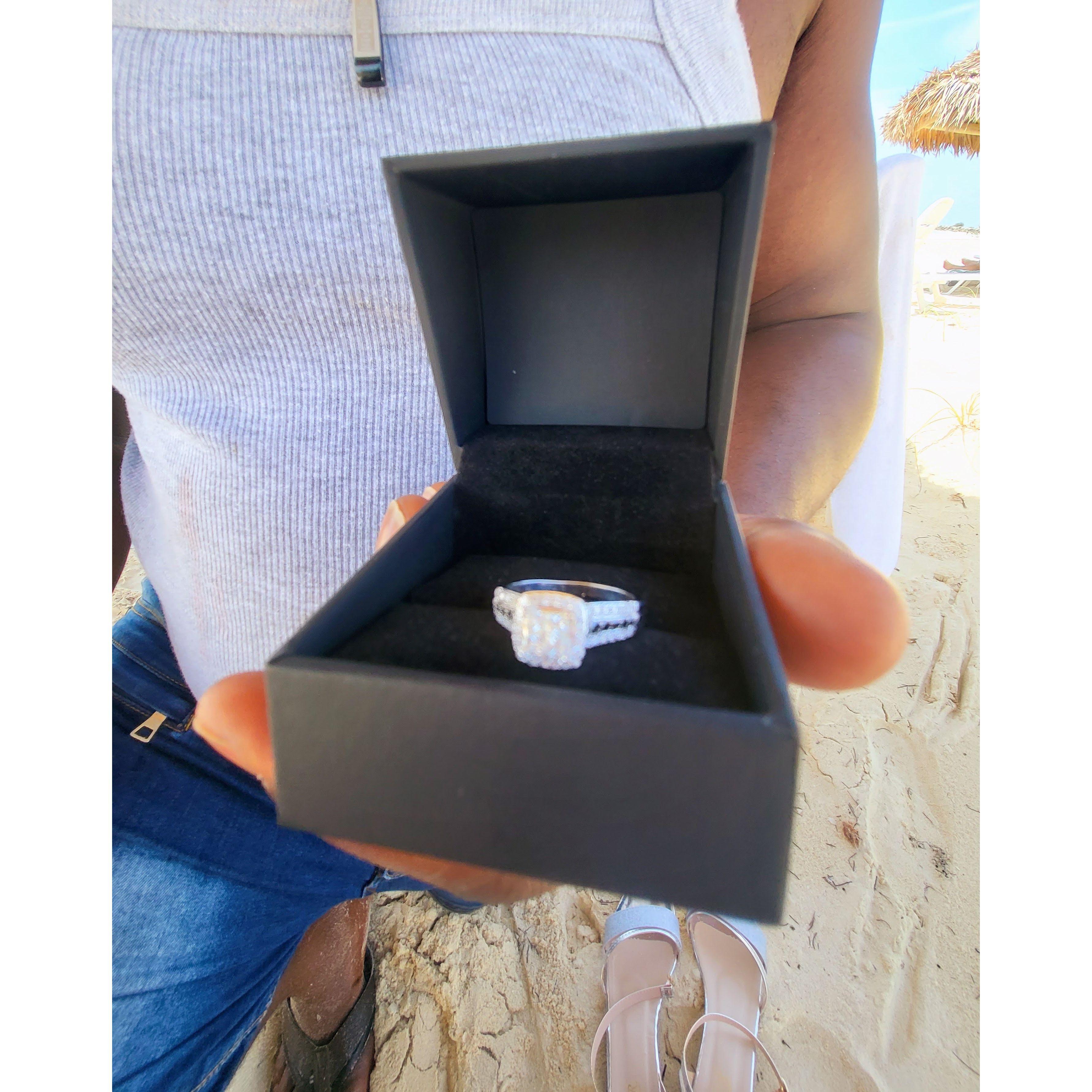 He proposed in the Bahamas! Look at the black and white diamonds!
