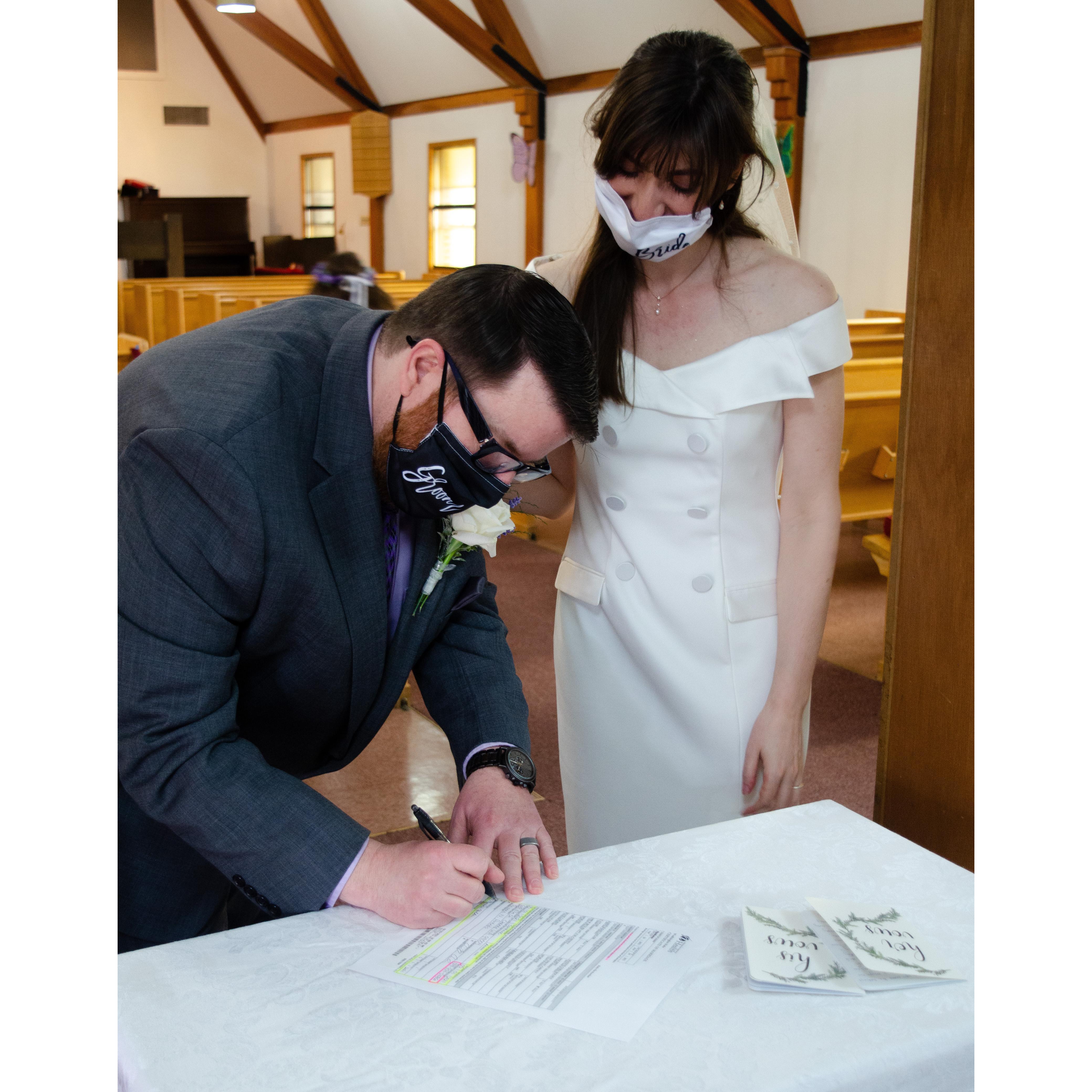 Signing the license.