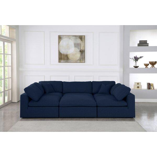 Robesonia 119" Reversible Modular Sectional with Ottoman