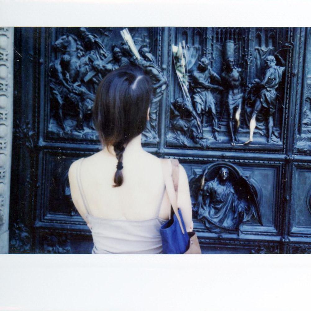 Sarah admiring the doors of the Duomo in Milan, 2015