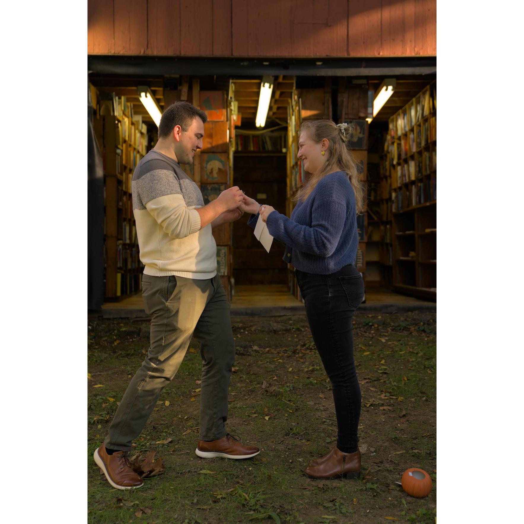 Then Sarah held a ring out to Eric and asked him the big question "Will you marry me too?" (He said yes!)