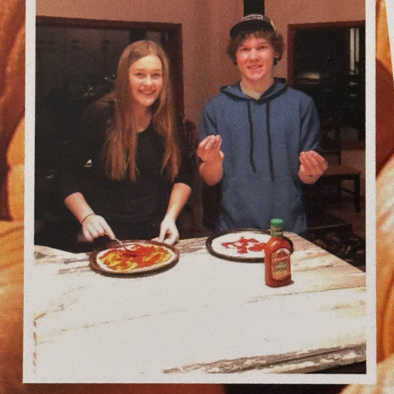 Pizza making at the cabin, we look like babies!
