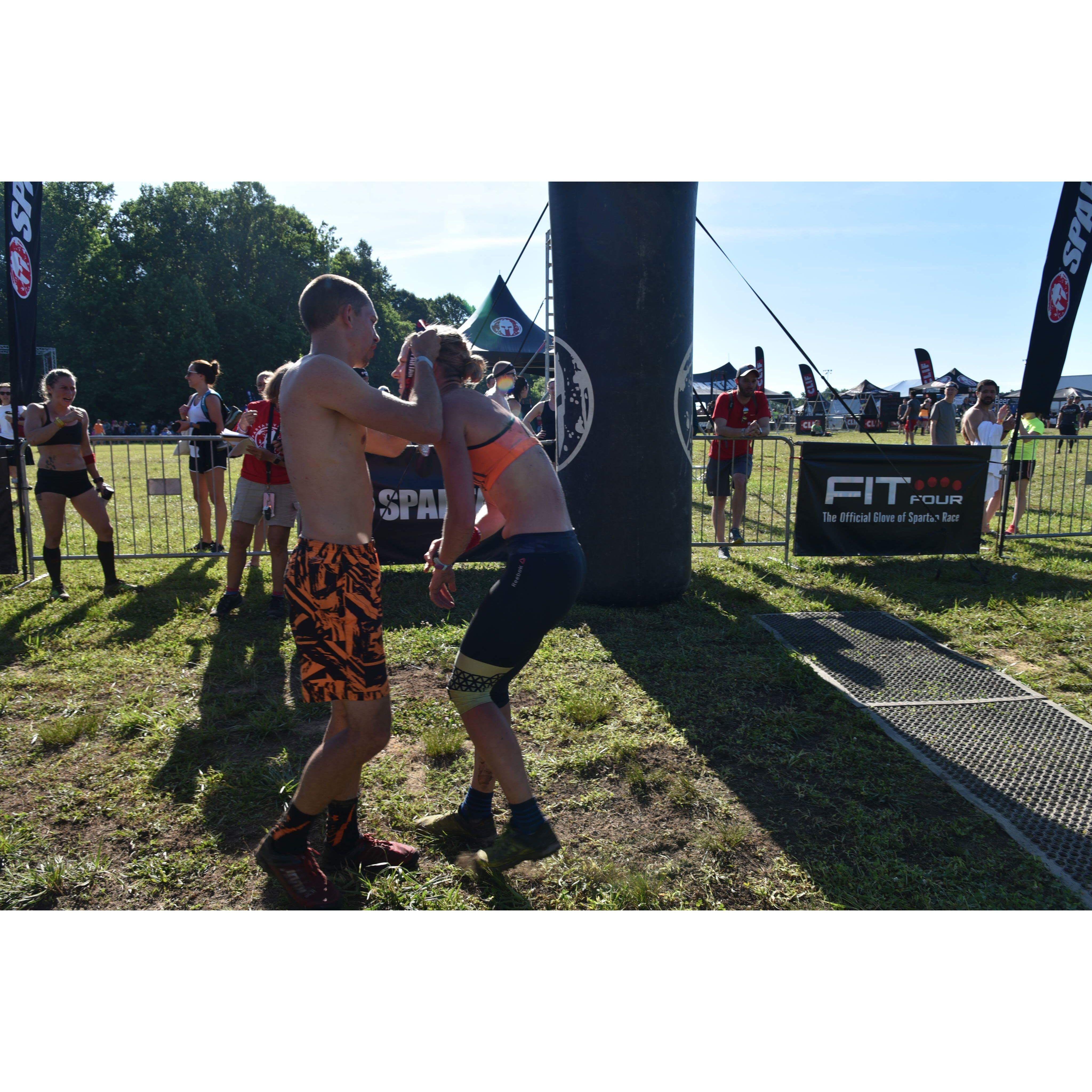 Since we've been together there hasn't been a single finish line that Tyler hasn't handed me a medal at.