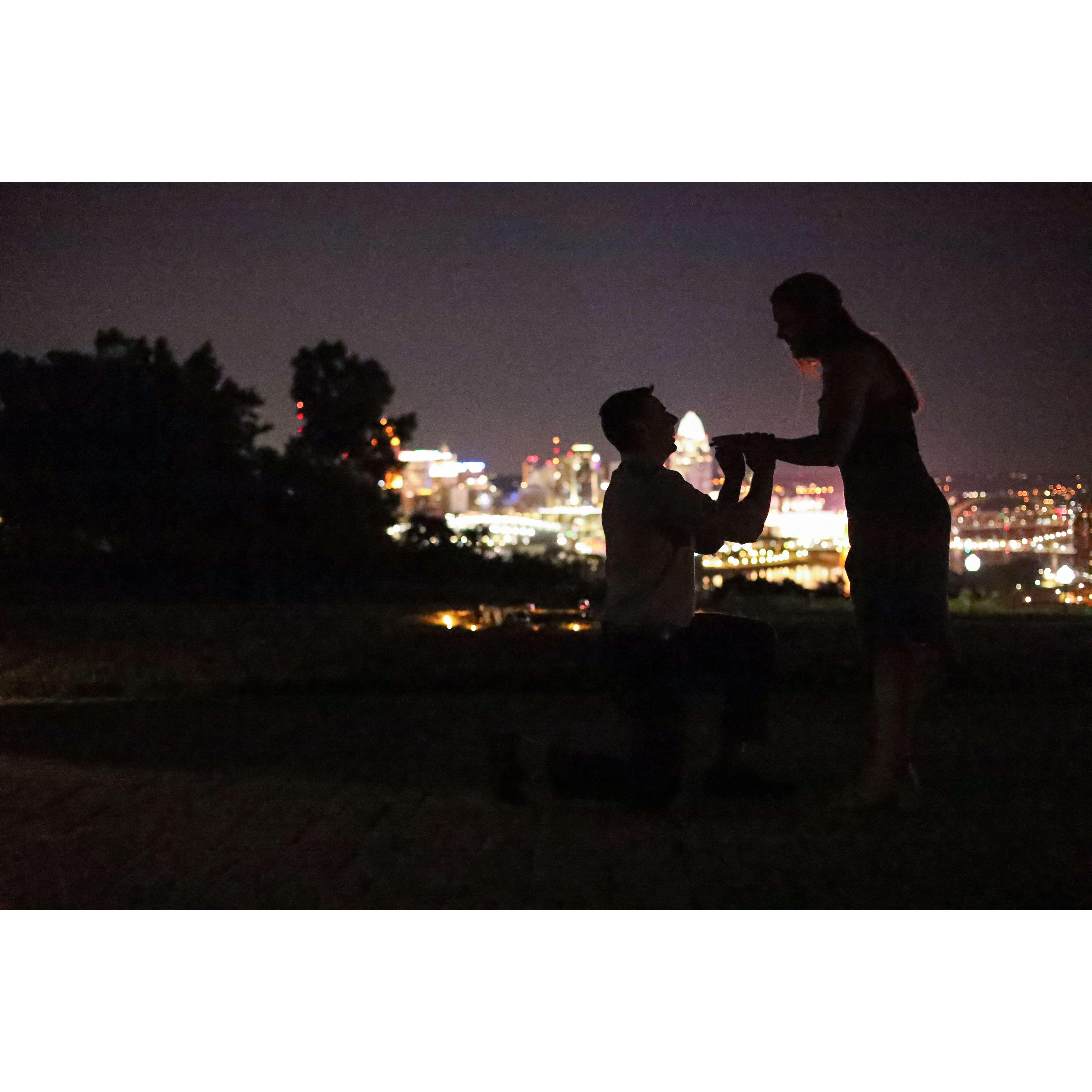 After an elegant steakhouse dinner, John popped the question in view of the Cincy skyline by a candlelit blanket complete with wine and cheesecake! I was totally surprised and over the moon excited :)
