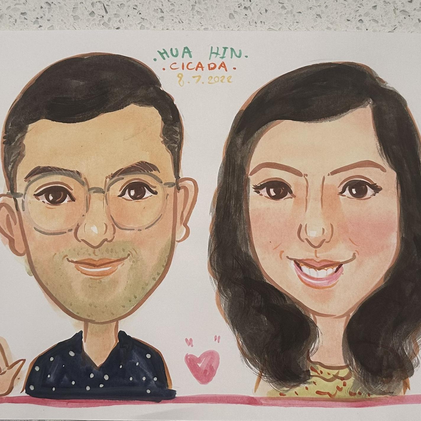 A playful caricature of us at the Hua Hin night market on our first trip together to Thailand—who would have thought that a few years later, we'd be getting married in Hua Hin on the very same date!