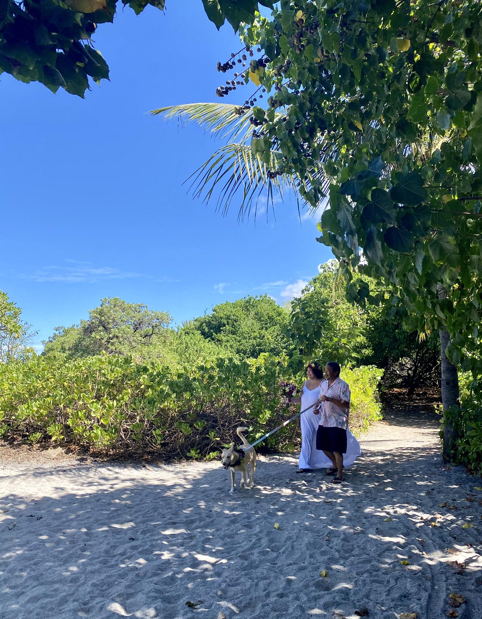 Robert, Leilani, and Aurora walking in to the beach park