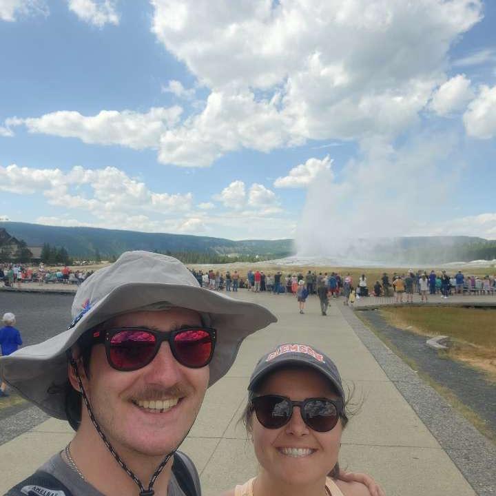 Watching Old Faithful erupt in Yellowstone National Park