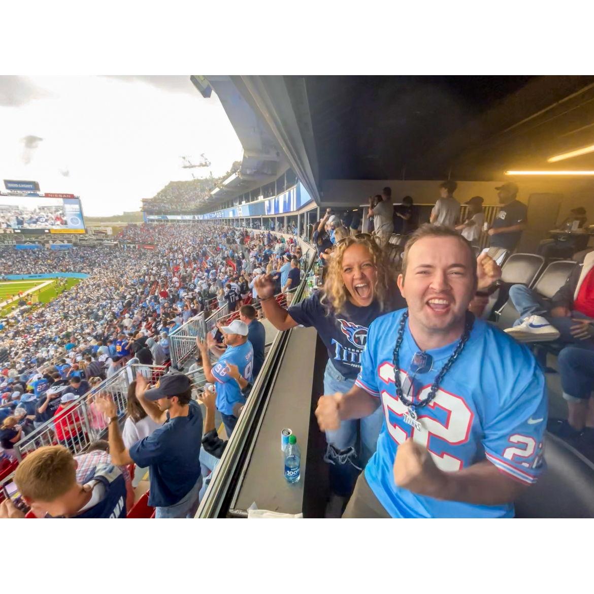 We both are huge football fans! Although we support rival college teams, we both love the Tennessee Titans. This was taken at our first game together.
