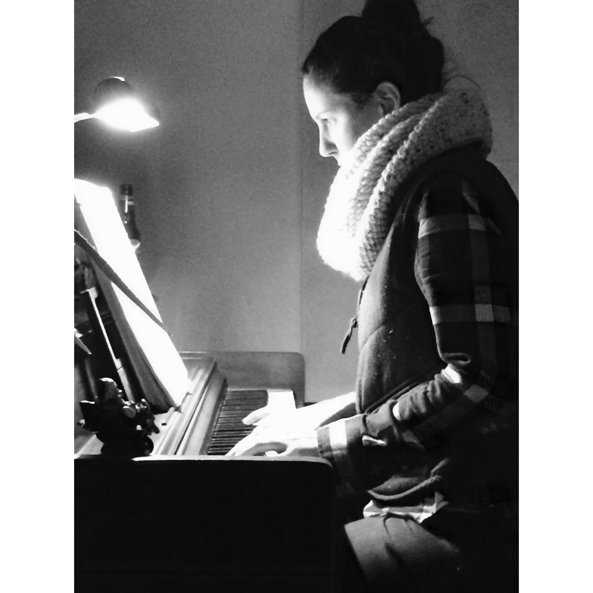 Luke captured this after I insisted we move my piano to the new house.... A labor of love.
