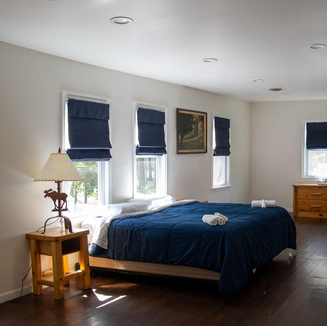 Sneak peak at the private accommodations at Camp Lindenmere - room with a queen size bed!