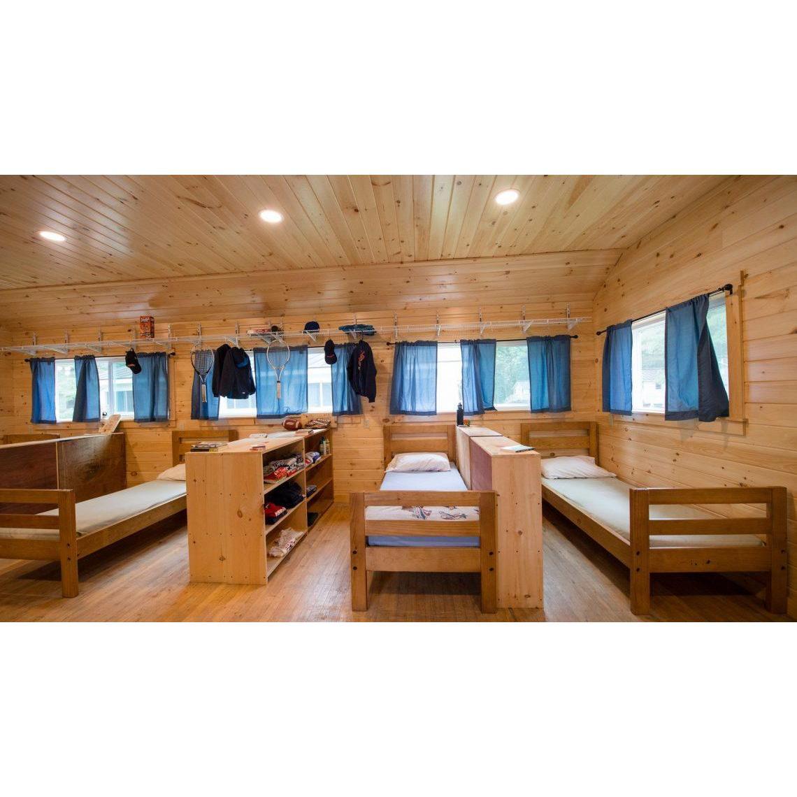 Each cabin has 10+ single beds with private cubbies/shelf space