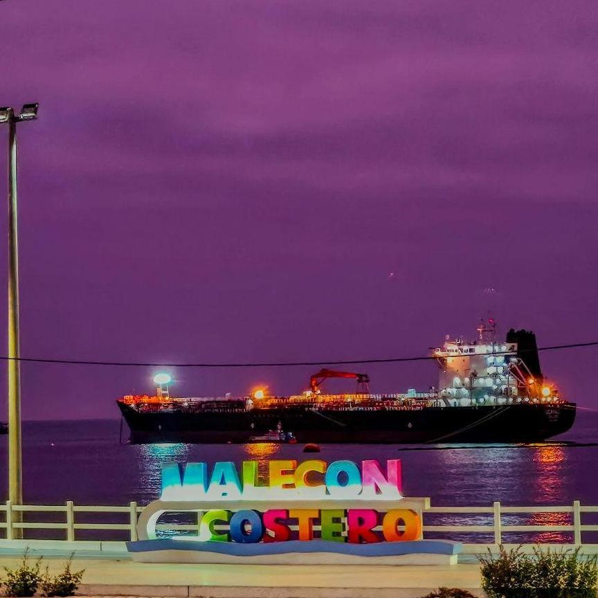 Enjoy a walk at night next to the sea