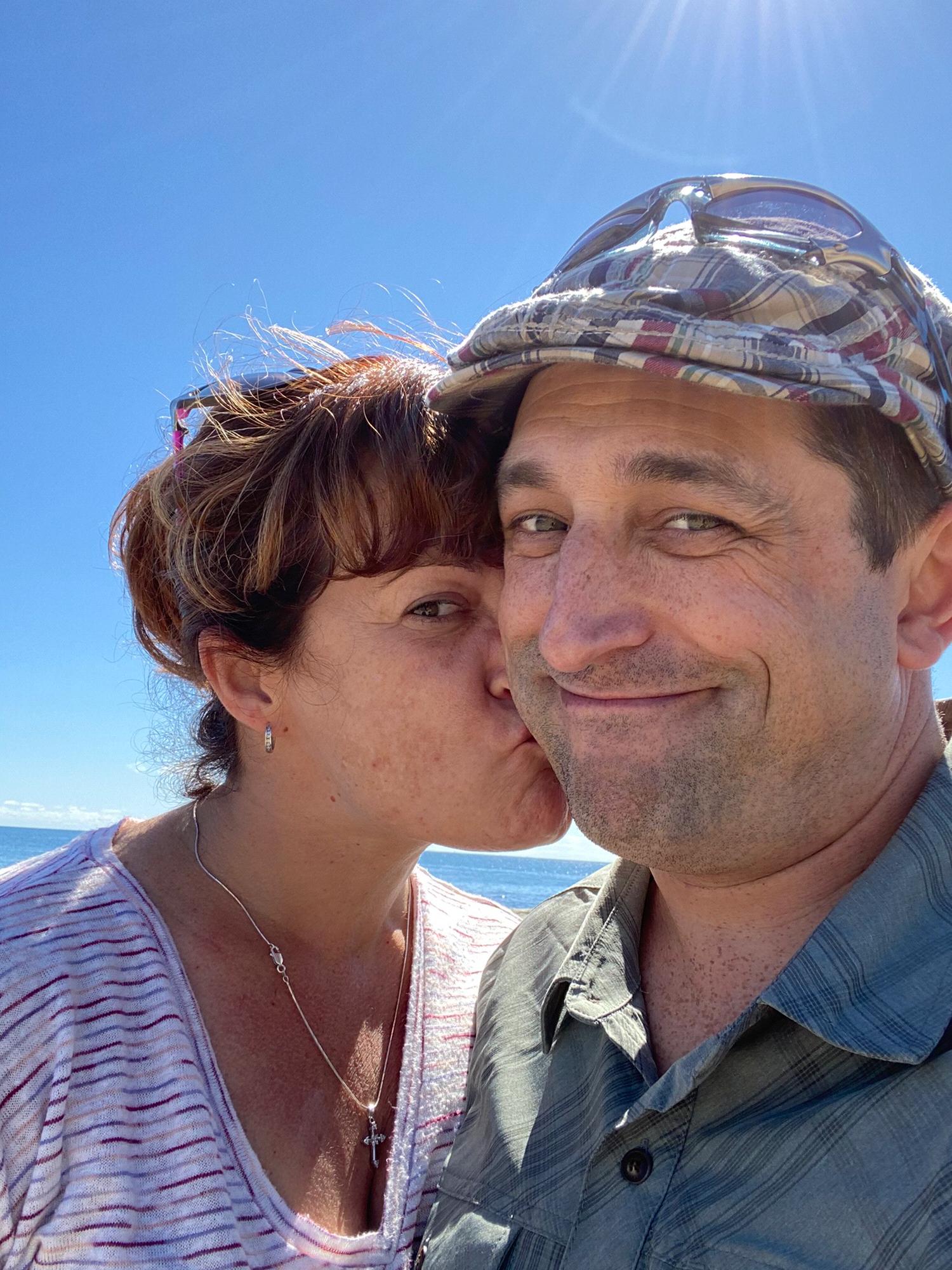 Newly engaged, bluebird sky, lighthouses and ocean.
