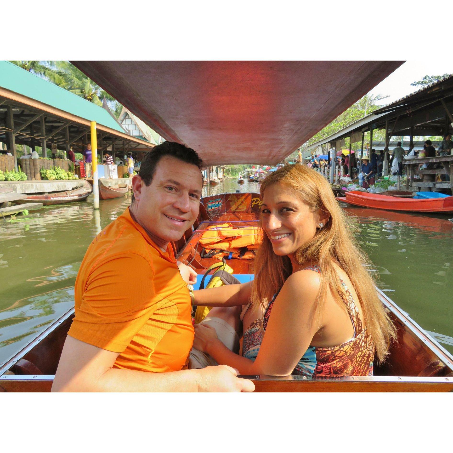 On a boat ride through markets in Thailand.