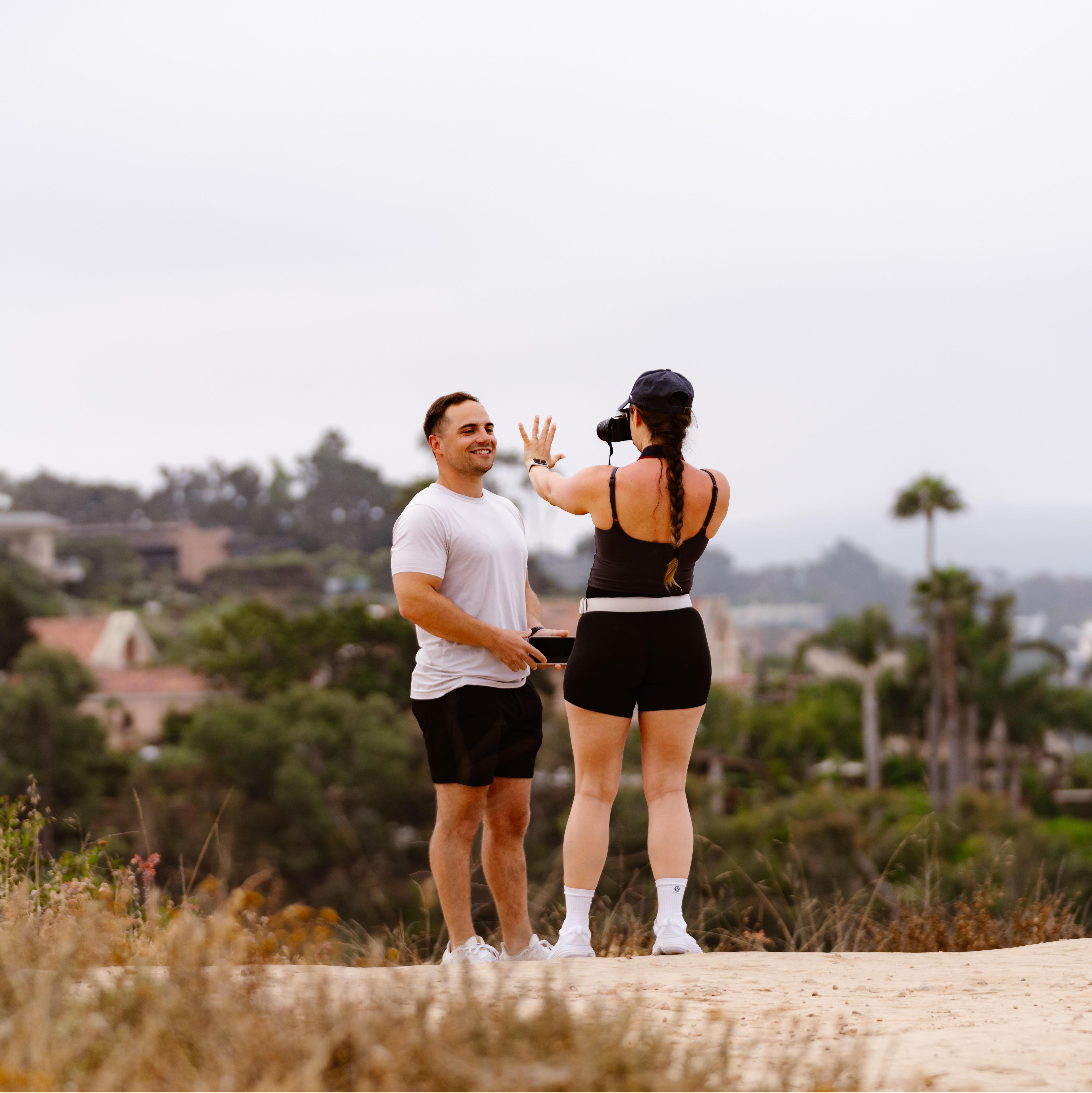 I took this picture seconds after he proposed, and our hidden photographers wound up catching that moment too!