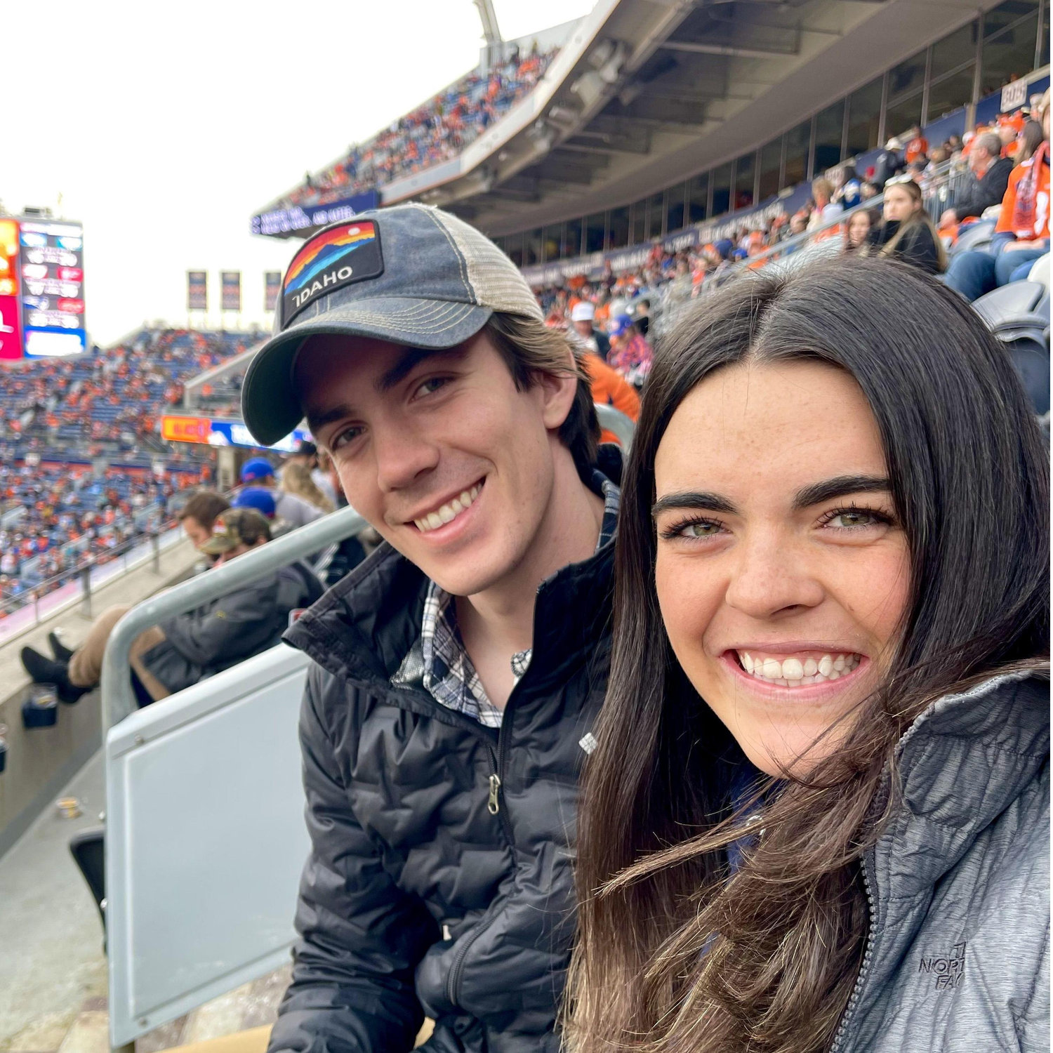 Abby and Alec's first NFL game (Penny not pictured). Watching the Broncos play tells Alec that Denver might be a pretty fun place to move!
