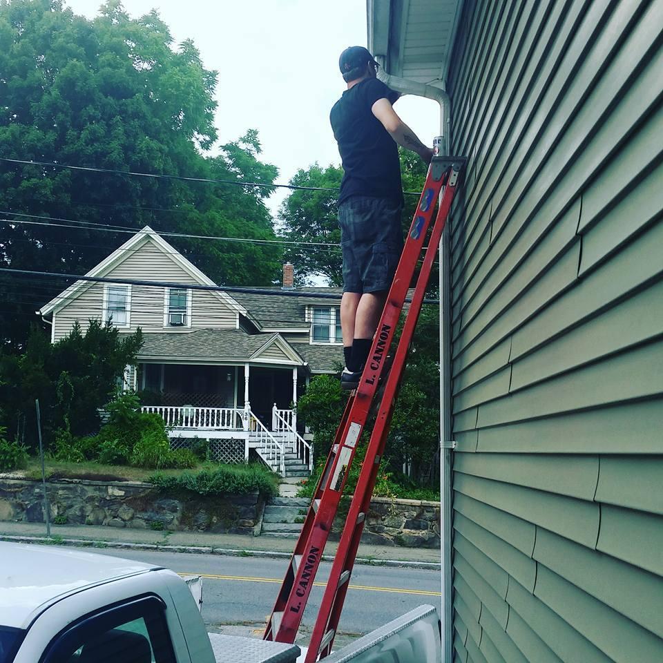 Luke fixing stuff on our new house. Notice the cannon stamp on the ladder, every tool needs a label!