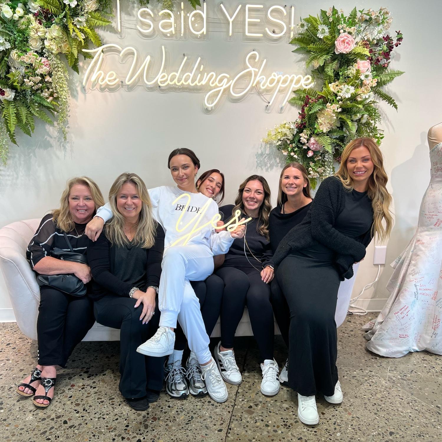Paige and her best friends after saying yes to the dress.