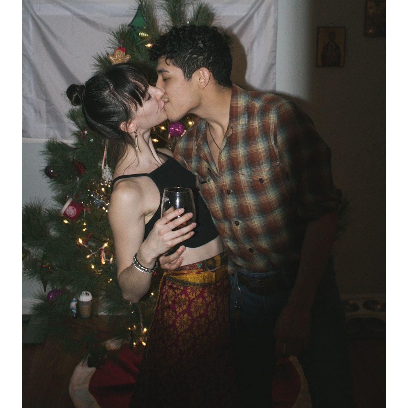 Our first New Year's party in our apartment in front of our first Christmas tree!