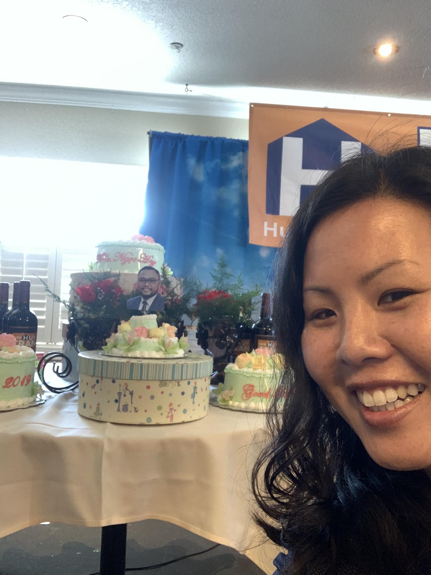 When Huy ran for office, someone made a cake with his face on it. Joanne thought it was hilarious.