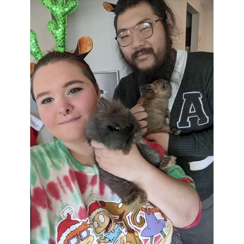 Us on Christmas Eve 2020 with our pet bunnies Barack and Pancake