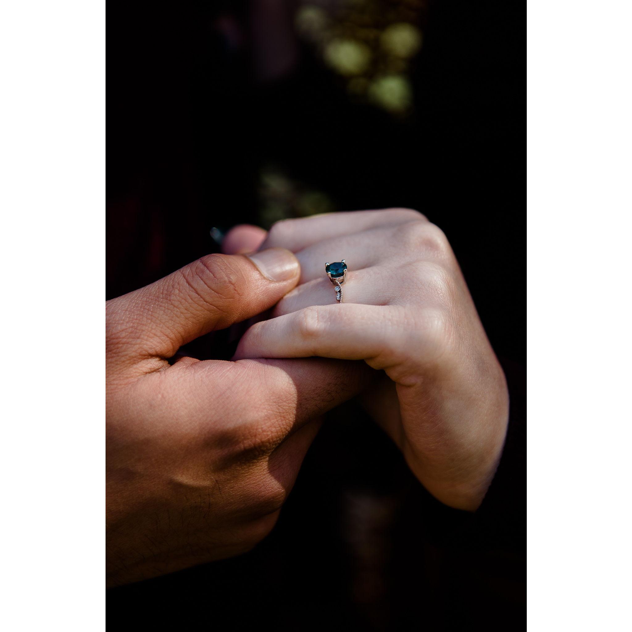 Justin burst out "I've been trying to give you this all night!" It was a ring!