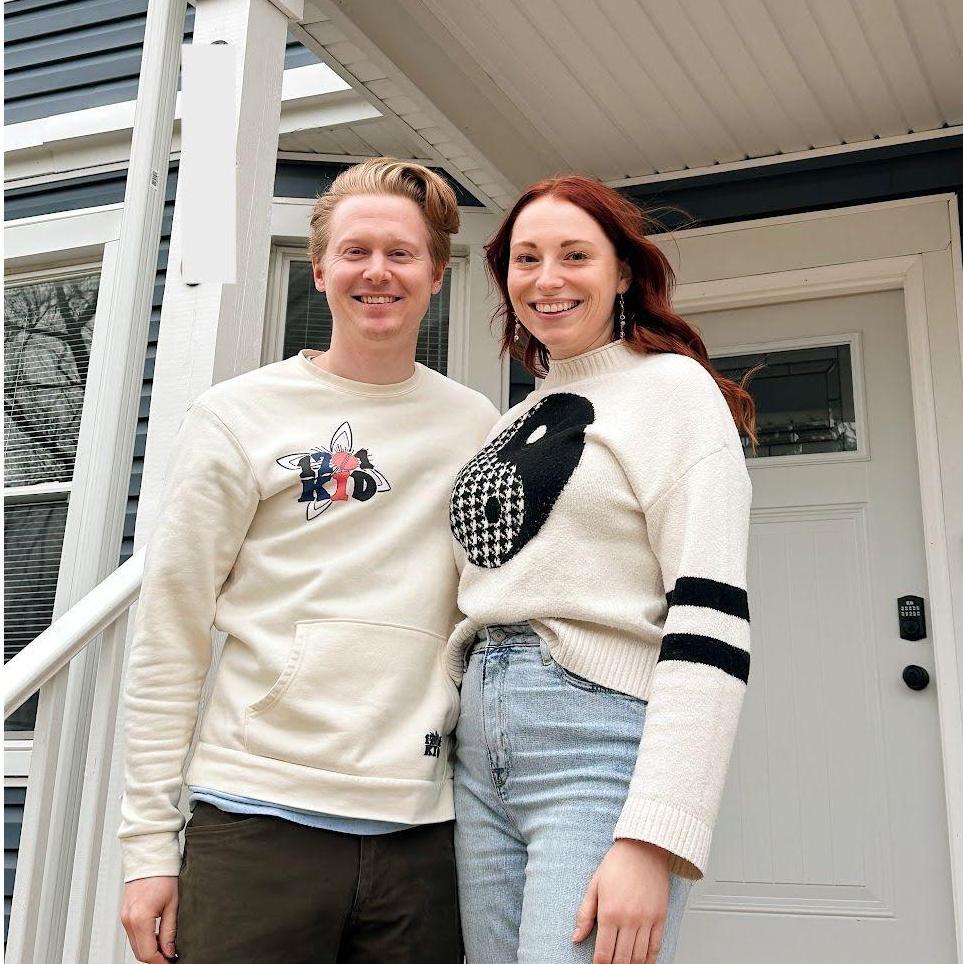 Standing in front of our first home!