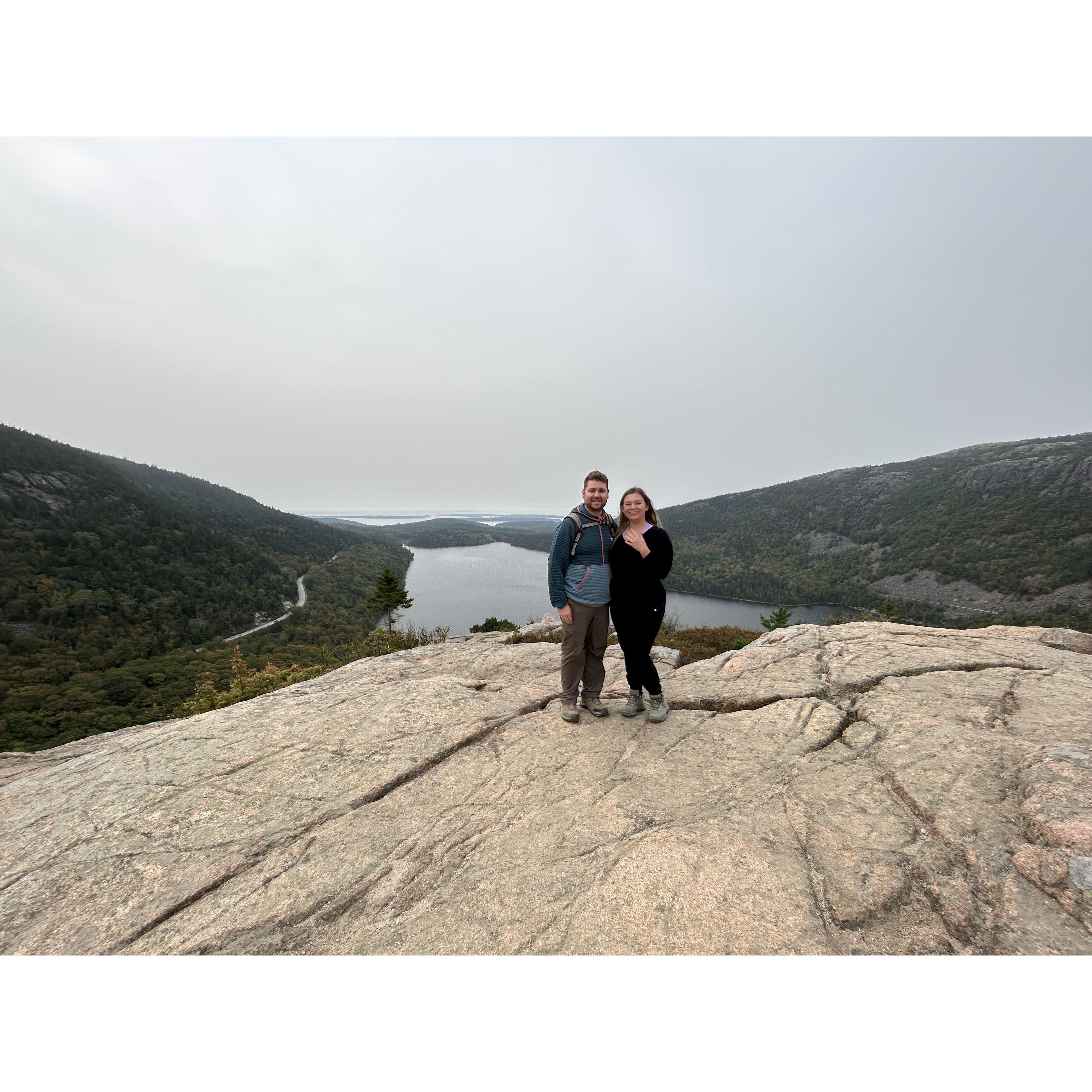 Luke proposed in Acadia National Park on the Pebble rock hike. Another fellow hiker snapped this photo of us after he proposed.