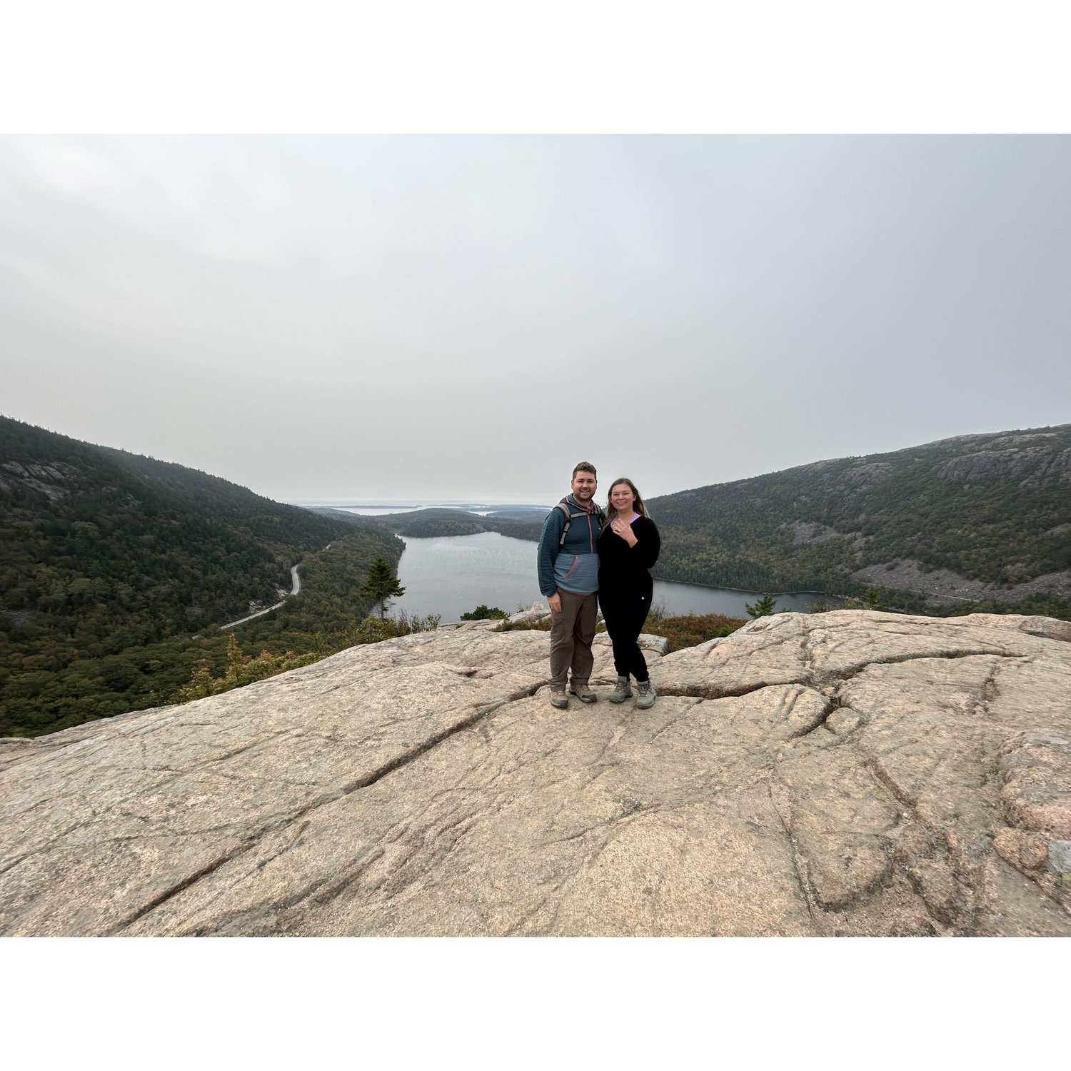 Luke proposed in Acadia National Park on the Pebble rock hike. Another fellow hiker snapped this photo of us after he proposed.