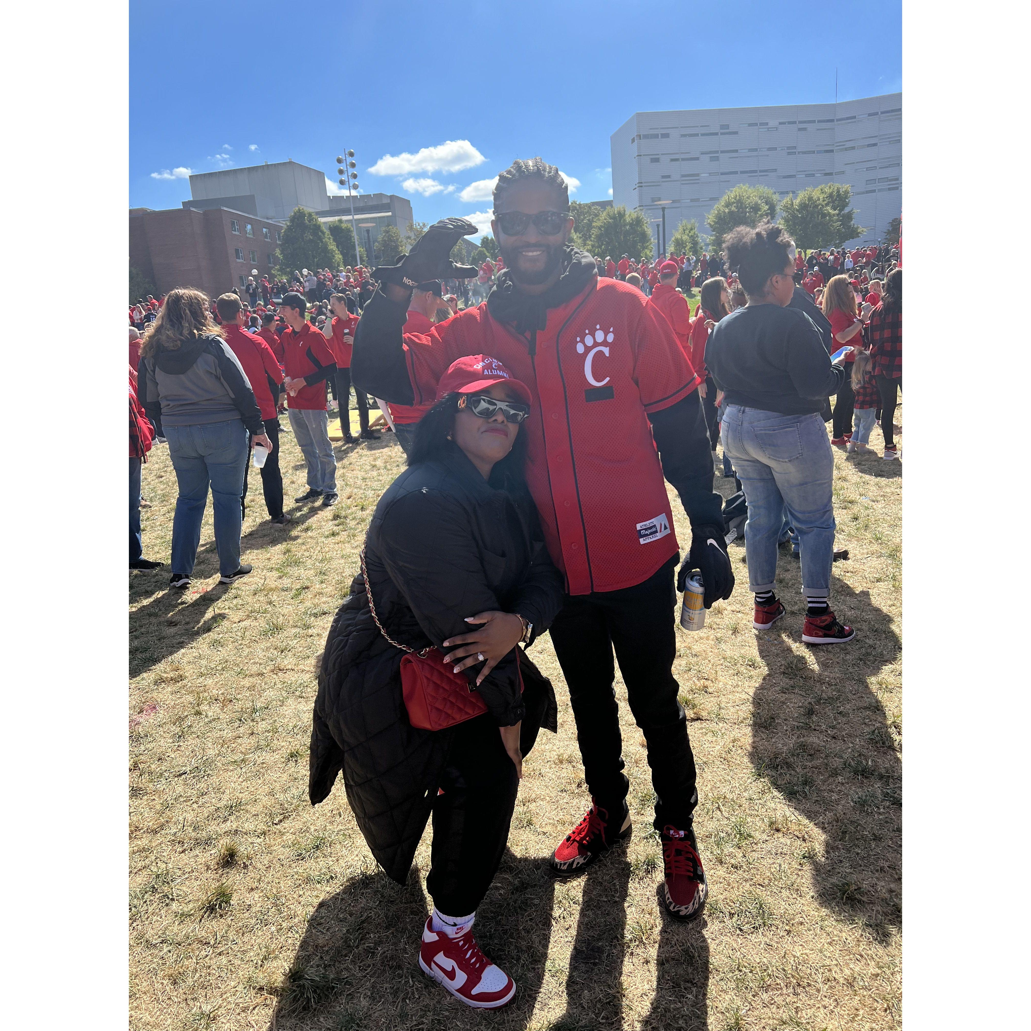 UC Homecoming 2022. We both attended UC, however we didn't know each other (well according to Dexter I ignored him lol) Nonetheless we wouldn't be here without UC!