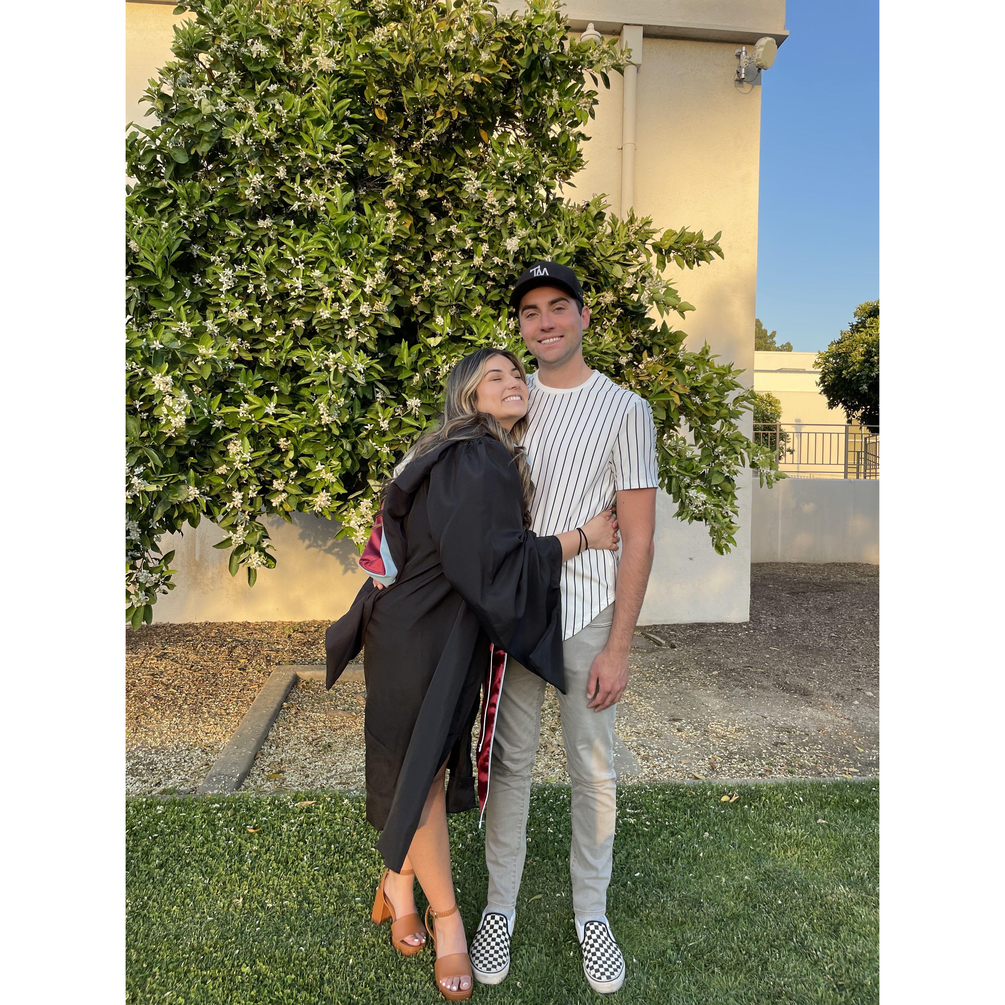 Mia's graduation from grad school in 2022.